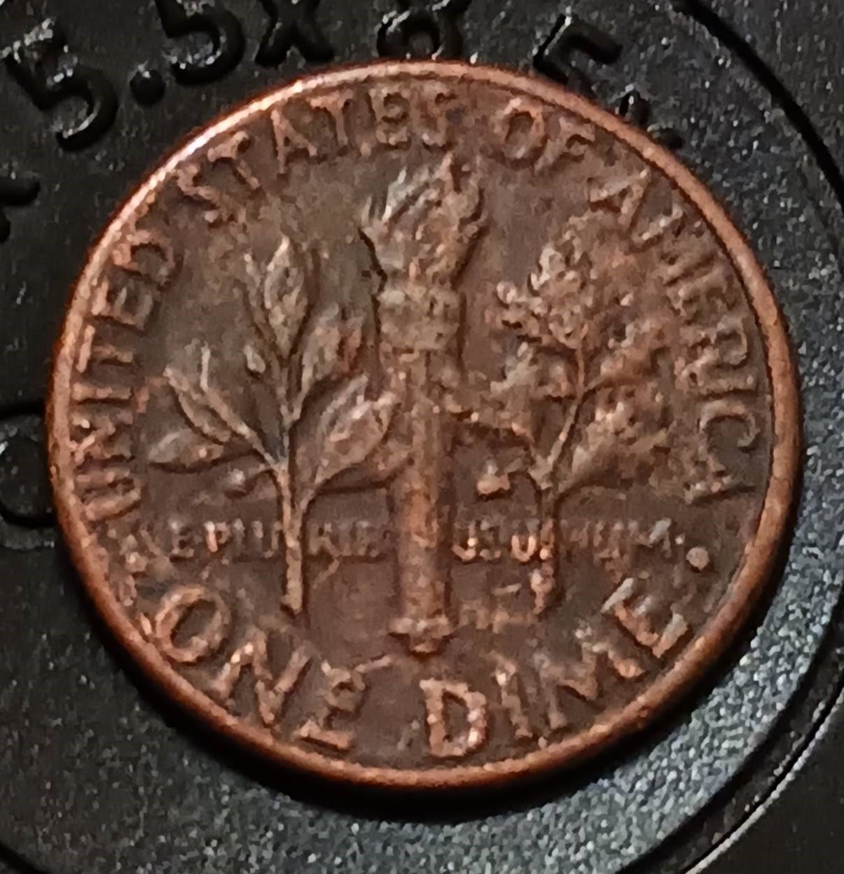 1978 Roosevelt dime missing clad layer error exposing the reddish-orange copper core on one face